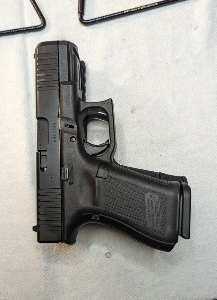 Glock 19 almost the same size with the 15 round magazine.